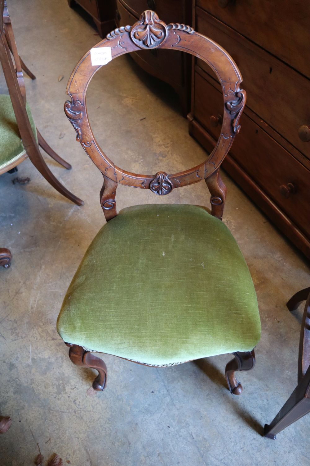 Two Edwardian inlaid mahogany tub shaped elbow chairs and a Victorian walnut salon chair